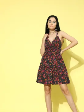 Berrylush Women Purple & Green Floral Printed Halter Neck Sleeveless Tie-Up Backless Fit & Flare Mini Dress